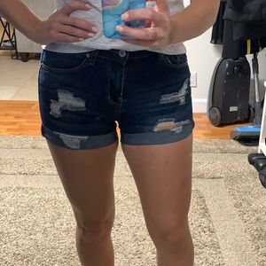 Dark blue high waisted stretchy jean shorts. Size 5/27